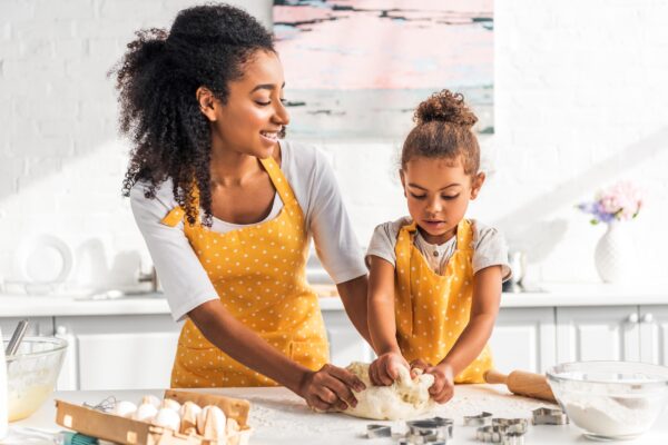 Mother and daughter baking together