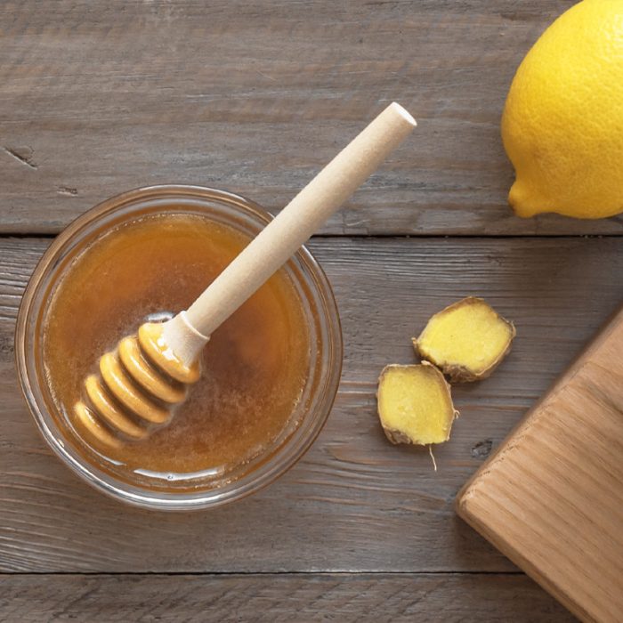 Hot tea with honey, lemon, and ginger.